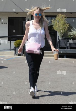 Dakota Fanning wore her casual ensemble with her Adidas Originals 'Superstar' sneakers and a pink C&eacute;line 'Trio' crossbody bag