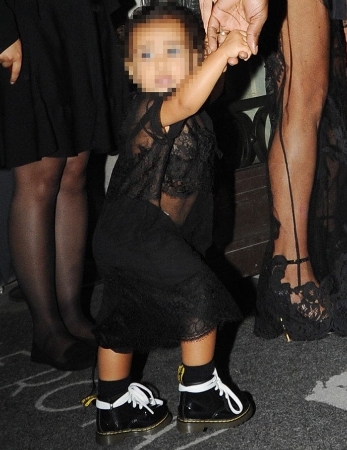 Kim Kardashian&rsquo;s daughter, North West, matched her mom in an all-black lace outfit with mini Dr. Martens boots, turning heads at Paris Fashion Week