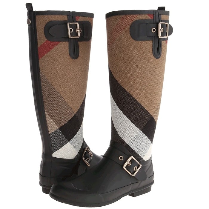 Exploded checks lend signature &eacute;lan to a stylish rain boot detailed with shining square buckles