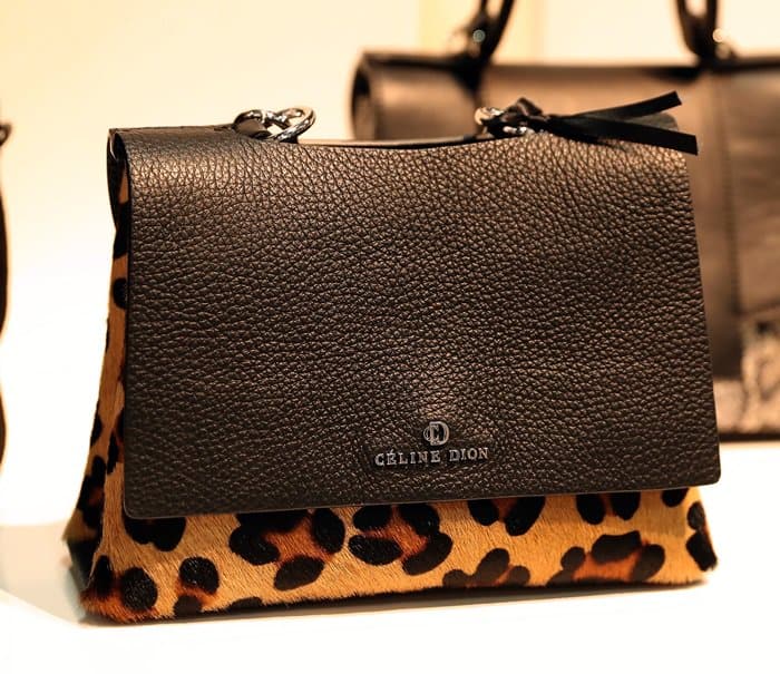 A bold C&eacute;line Dion handbag featuring a textured black leather flap and a striking leopard print bottom
