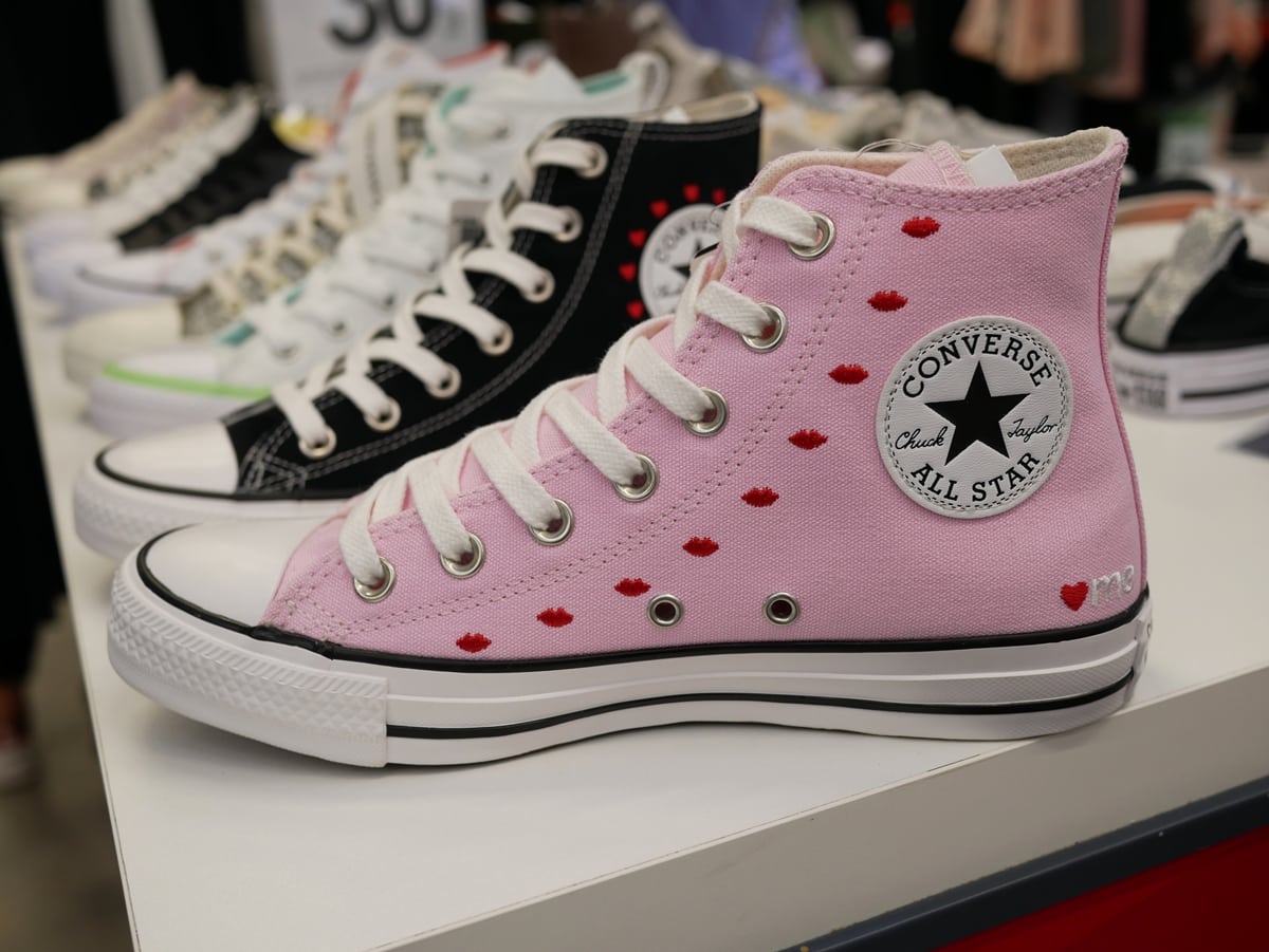 The pink Converse Chuck Taylor All Star high-top, featuring embroidered red hearts &mdash; a playful twist on the brand&rsquo;s most iconic silhouette