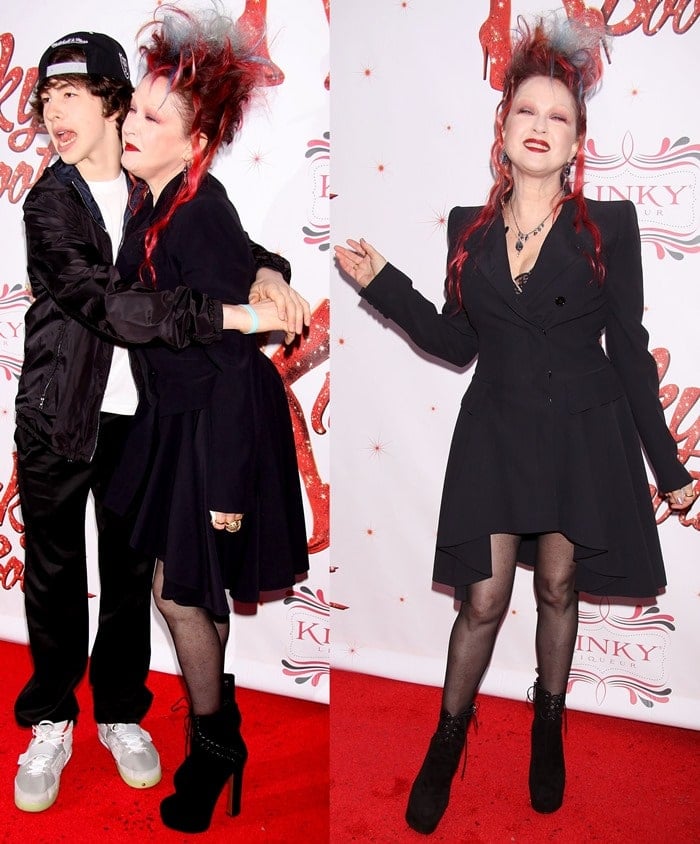 Cyndi Lauper, posing with Declyn Wallace Thornton, in black lace-up booties at the Broadway premiere of 'Kinky Boots' at Hirschfeld Theatre in New York City on April 4, 2013