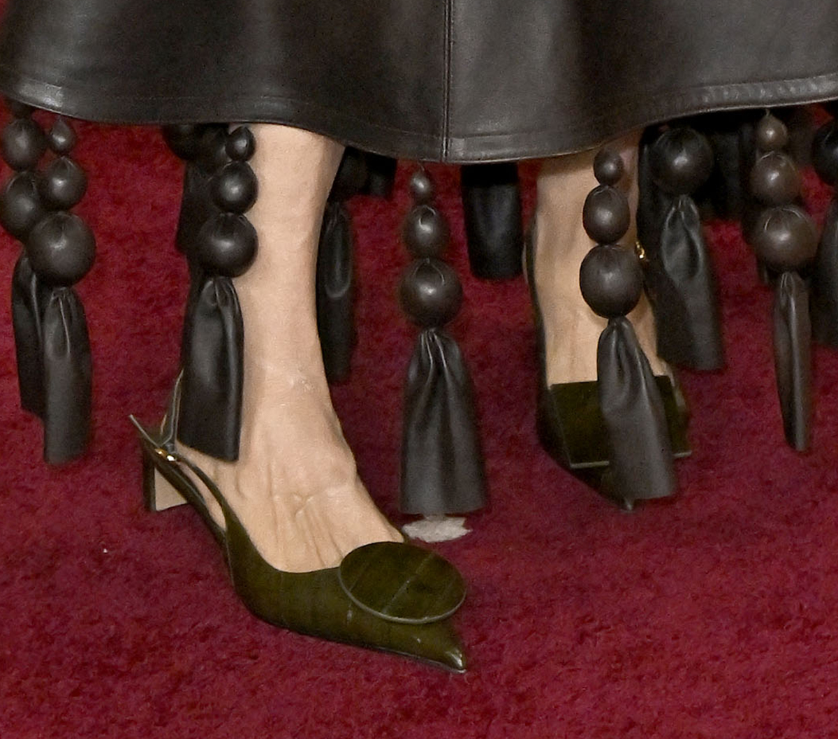 Casting director Francine Maisler embraces art deco fashion with the Jacquemus &ldquo;The Low Duelo&rdquo; slingbacks in dark khaki tanned eel leather with Rond-Carr&eacute; accents at the toes