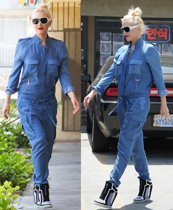 Gwen Stefani in a loose-fitting jumpsuit from L.A.M.B.&nbsp;featuring a drawstring waist and two silver zippered pockets on the front