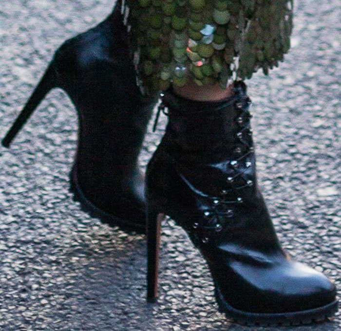 Two birds with one stone: Hailey wore her Ala&iuml;a boots for two Paris looks