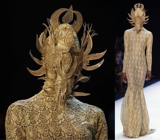 The ensemble of the show &mdash; an exquisitely detailed figure-hugging dress paired with a mask with woven extensions