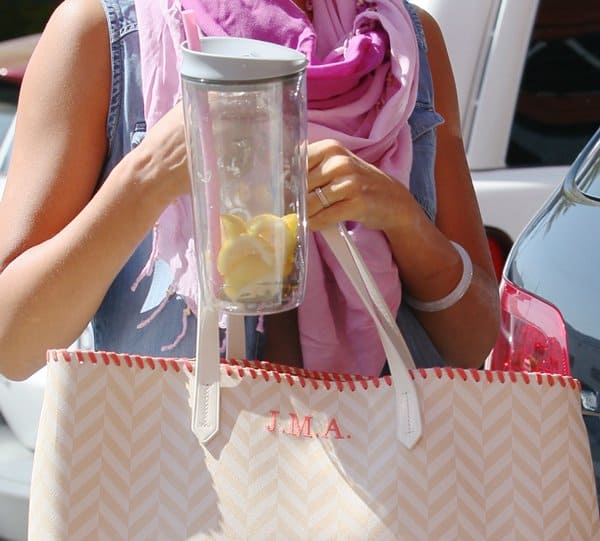 A closer look at Jessica Alba&rsquo;s Misela 'Edna' tote, personalized with her initials J.M.A., showcasing the trendy chevron design in beige and white