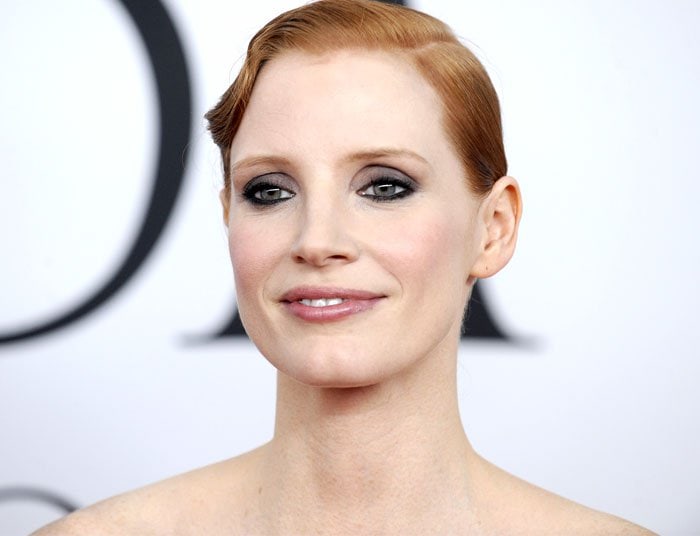 Jessica Chastain exudes elegance with her sleek updo and smoky eye makeup