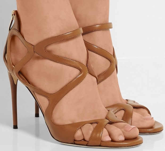 Jimmy Choo&rsquo;s signature &lsquo;Leslie&rsquo; sandals have caged straps to flatter and frame your foot