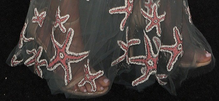 Jordana Brewster&rsquo;s nude sandals offered a barely-there finish that subtly showcased her perfectly polished pedicure beneath the starfish-embroidered tulle