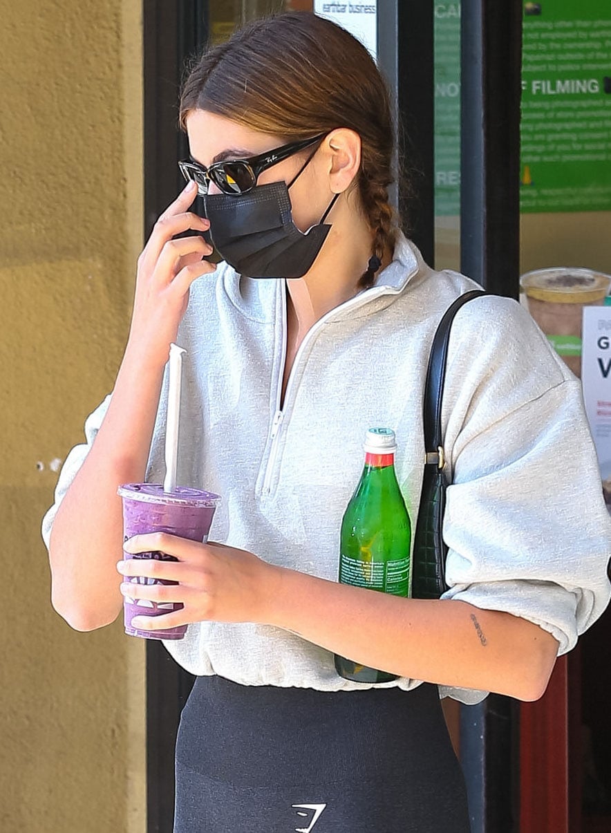 Kaia Gerber accessorizes with Ray-Ban sunglasses and Celine Ava shoulder bag
