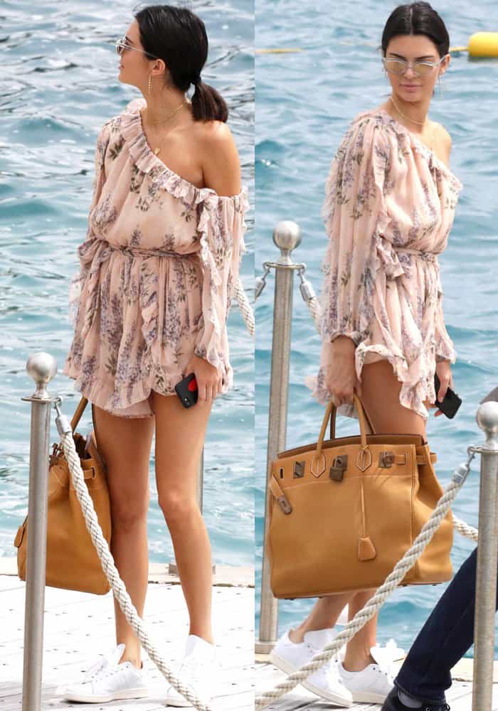 Kendall Jenner stuns in a floral Zimmermann romper, paired with white Adidas 'Stan Smith' sneakers and an oversized Herm&egrave;s Birkin bag, while enjoying a boat day in Cannes