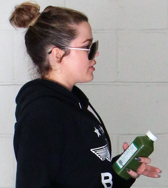 Khlo&eacute; Kardashian wears a black Boy London "Star Eagle" hoodie