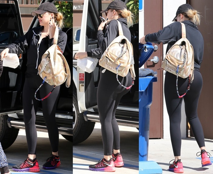 Khlo&eacute; Kardashian sported black tight black work out gear and a tomboy cap