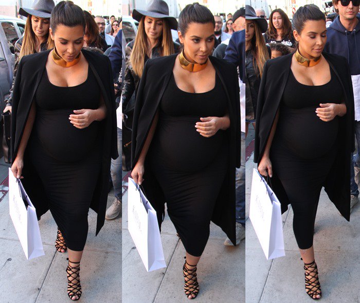 Kim Kardashian wore a gold choker and her favorite strappy Herm&egrave;s sandals in black.
