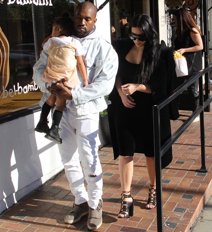 Kim Kardashian accessorized with 'Adele' sunglasses from C&eacute;line and completed the ensemble with a stunning pair of calfskin sandals from Tom Ford with eyelash-fringe trim