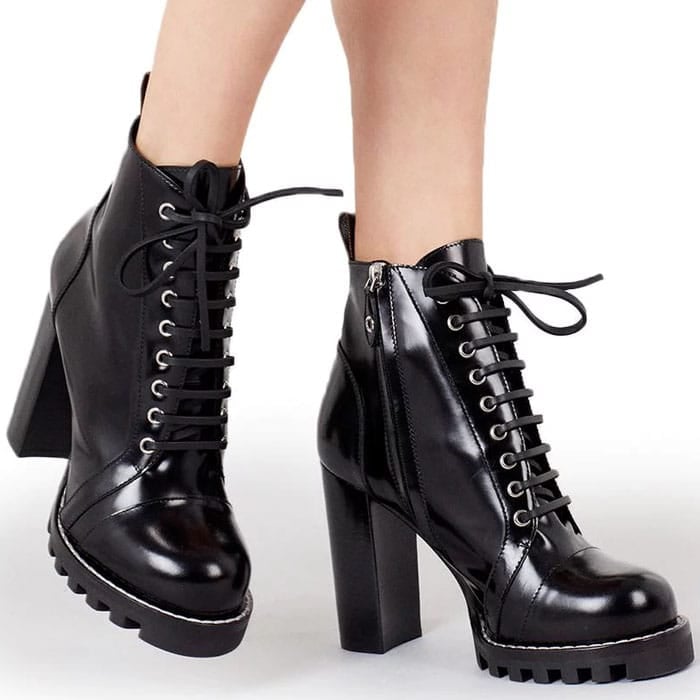 Louis Vuitton &lsquo;Star Trail&rsquo; ankle boots in black leather, featuring lace-up fronts, gold-tone eyelets, a chunky block heel, and a rugged lug sole