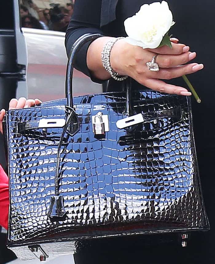 Mariah goes classic with an Herm&egrave;s "Birkin" tote in patent crocodile pattern leather