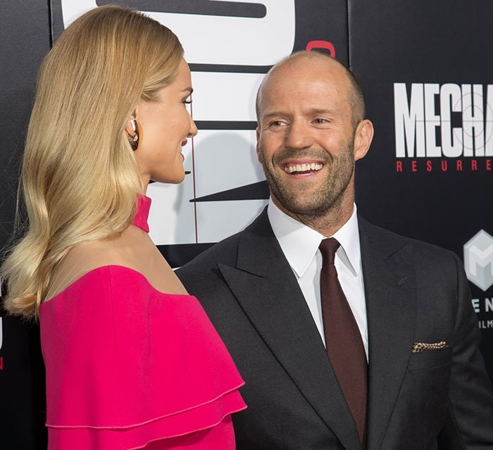 Rosie Huntington-Whiteley and fianc&eacute; Jason Statham pose for photos at the "Mechanic: Resurrection" premiere