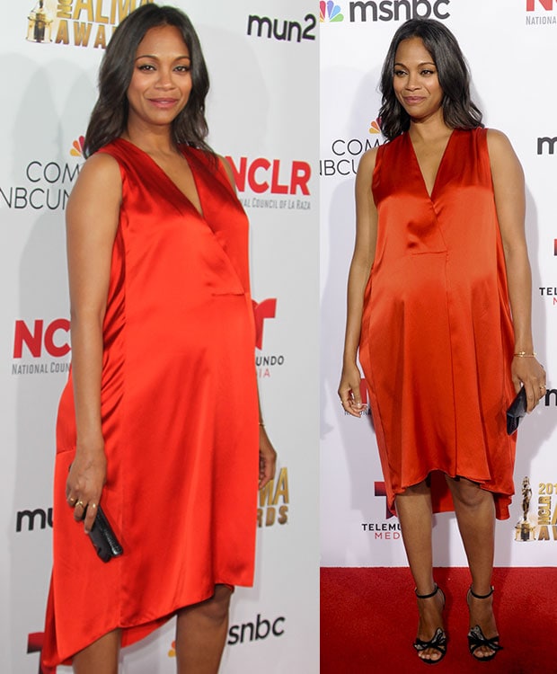 Zoe Salda&ntilde;a wearing a bright orange-red Narciso Rodriguez dress