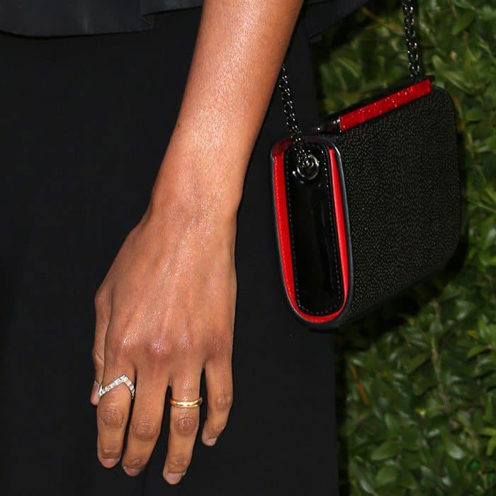 Zoe carrying Christian Louboutin&rsquo;s 'Vanite' clutch