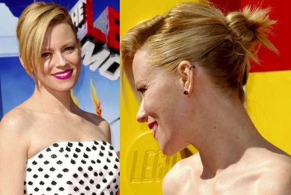 Elizabeth Banks'&nbsp;hair was swept to one side and styled in a messy bun to show off her ear cuff from Jack Vartanian