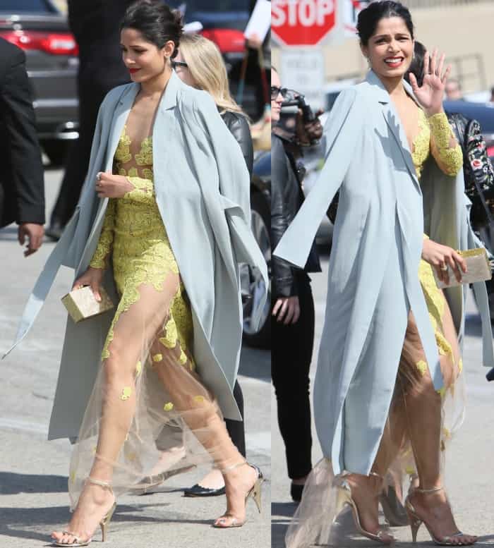 Freida Pinto's&nbsp;yellow gown features long sleeves and floral lace embroidery in addition to a floor-length sheer skirt