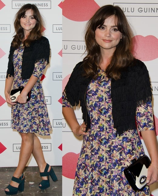 Jenny Louise Coleman combines a colorful floral dress and black fringe bolero with teal platform heels, finishing her playful look with Lulu Guinness&rsquo;s whimsical 'Doll Face Fifi' clutch