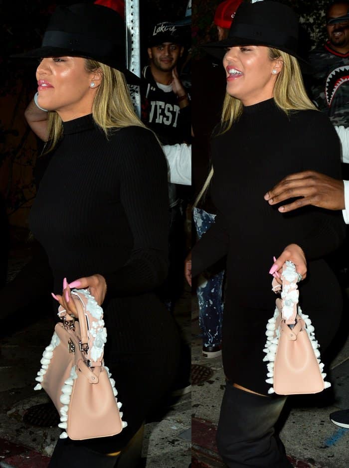 Khlo&eacute; Kardashian wearing a Naked Wardrobe dress, a Maison Michel fedora, and black slouchy over-the-knee boots