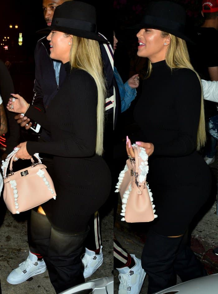 Khlo&eacute; Kardashian wearing a Naked Wardrobe dress, a Maison Michel fedora, and black slouchy over-the-knee boots
