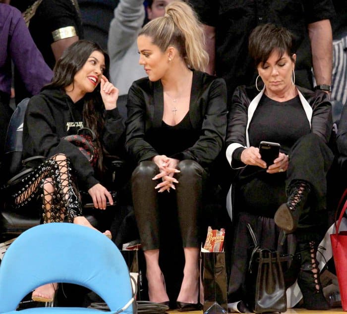 Kourtney Kardashian wearing Yeezy sandals, Khlo&eacute; Kardashian wearing black pointy-toe pumps, and Kris Jenner wearing black lace-up booties at Lakers vs. Cavaliers basketball game