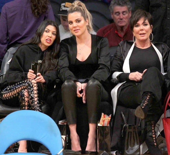 Kourtney Kardashian wearing Yeezy sandals, Khlo&eacute; Kardashian wearing black pointy-toe pumps, and Kris Jenner wearing black lace-up booties at Lakers vs. Cavaliers basketball game