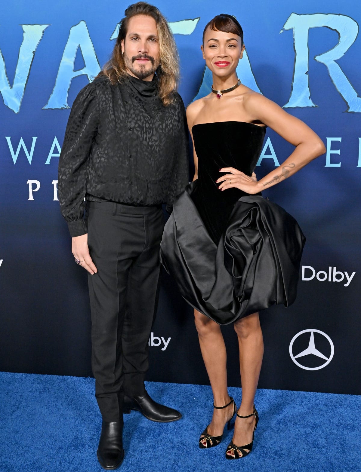 Zoe Salda&ntilde;a with husband Marco Perego in matching all-black looks at the Los Angeles premiere of Avatar: The Way of Water