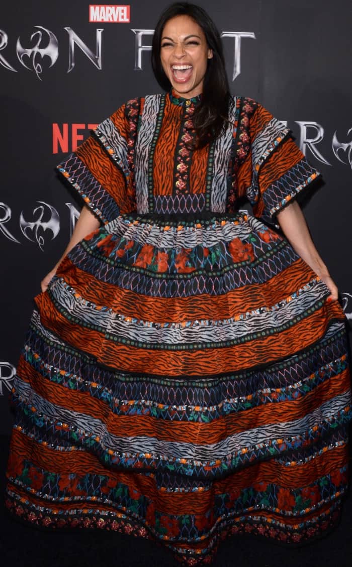 Rosario Dawson radiates joy in a bold Kenzo x H&M patterned maxi dress at the Iron Fist New York screening, embracing its voluminous silhouette with playful confidence