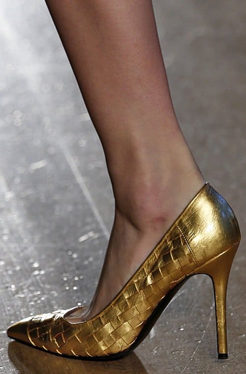 Footwear as Art: The exquisite L&rsquo;Wren Scott gold-leaf pumps from the Autumn/Winter 2013 collection at London Fashion Week, embodying the designer's vision of luxury and style that perfectly complements Nicole Kidman's red carpet look