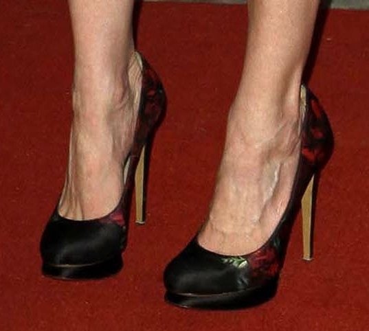 Kirsten Dunst showcases her feet in Nicholas Kirkwood's floral print satin pumps featuring a striking blend of elegance and bold design